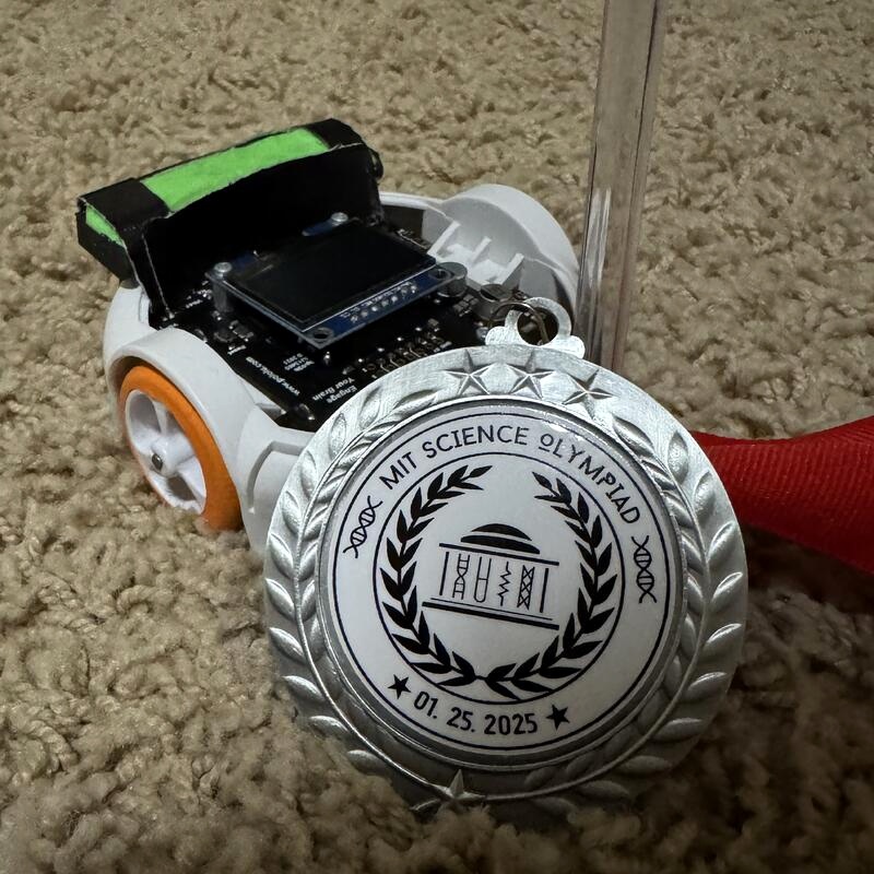 Maze robot with an MIT Science Olympiad medal